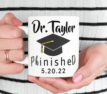 Load image into Gallery viewer, Personalized PHD Grad Mug With Graduation Cap - PhinisheD